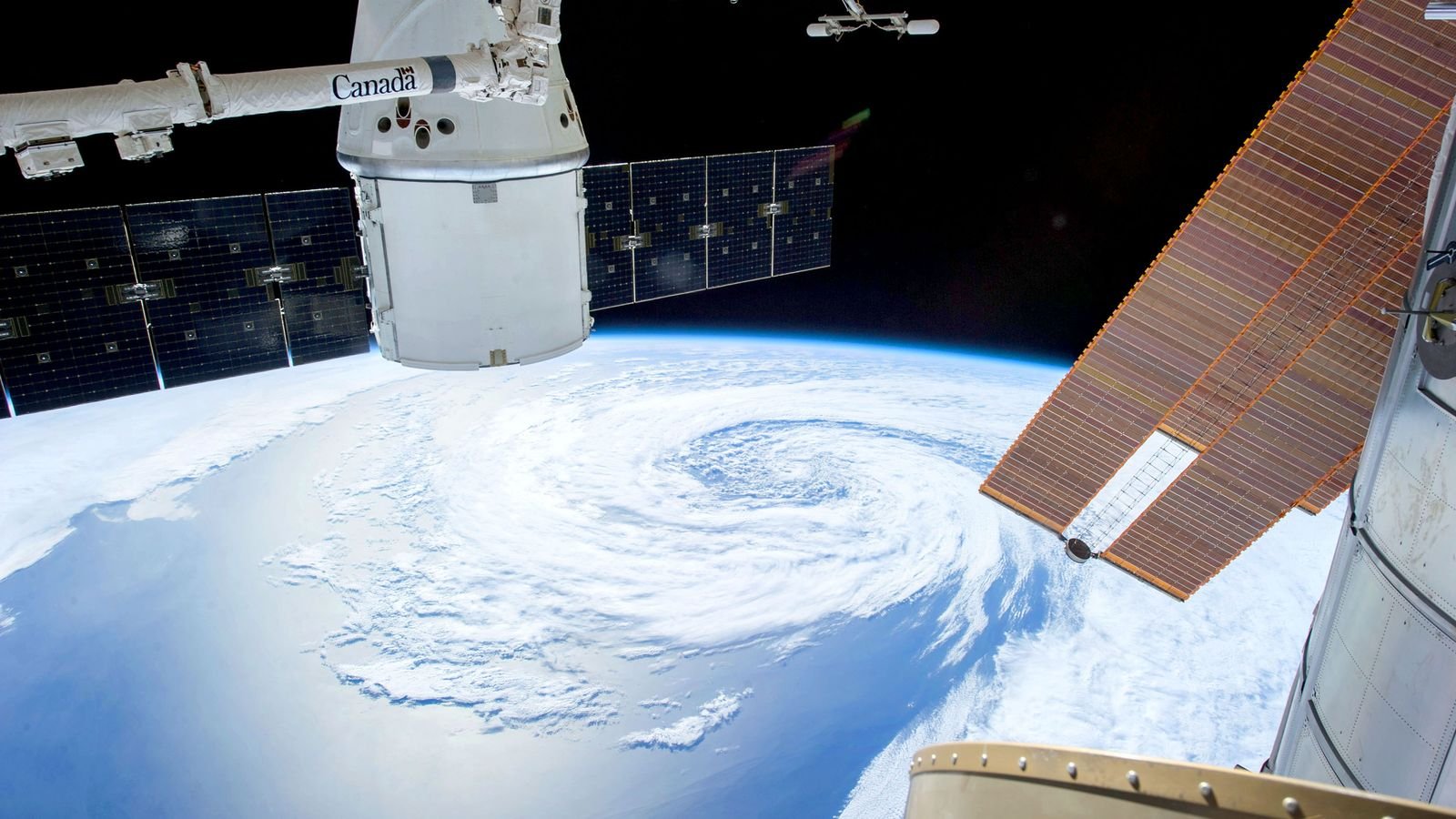 A view of Earth from a space station with solar panels and satellite modules, representing alternative data collection for financial analysis